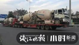 巨無霸來了！半掛車“背”著水泥車欲上高速！